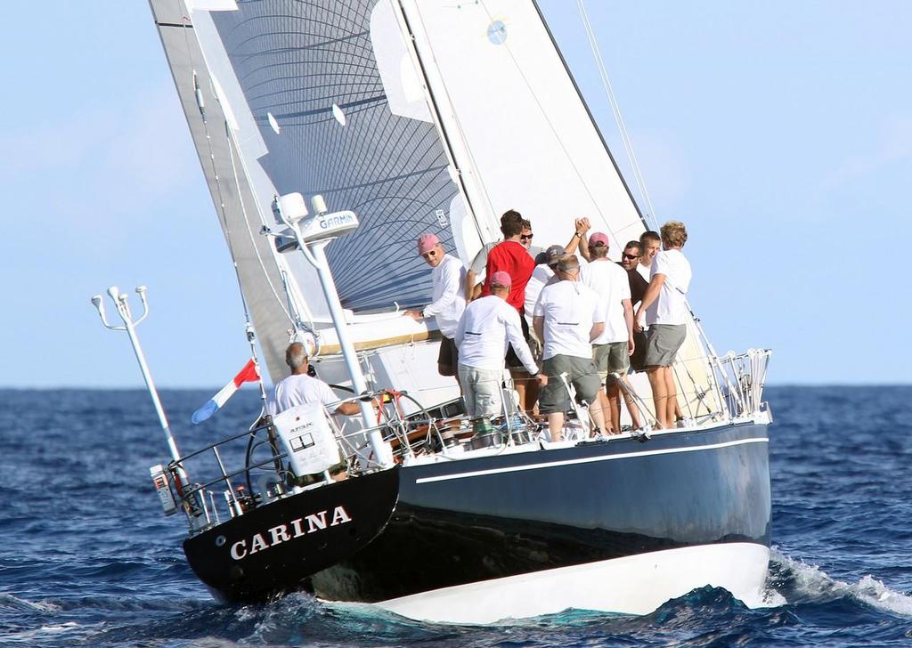 Rives Potts steers ’Carina' to another Lighthouse Trophy for first place in the St. David's Lighthouse Division, his second consecutive win, as his family filled crew hand out high fives after crossing the finish line in Bermuda - 49th Newport Bermuda Race 2014 © Charles Anderson